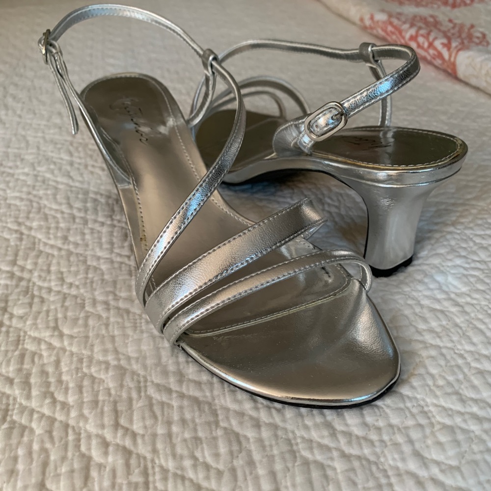 Strappy , metallic silver heels.
